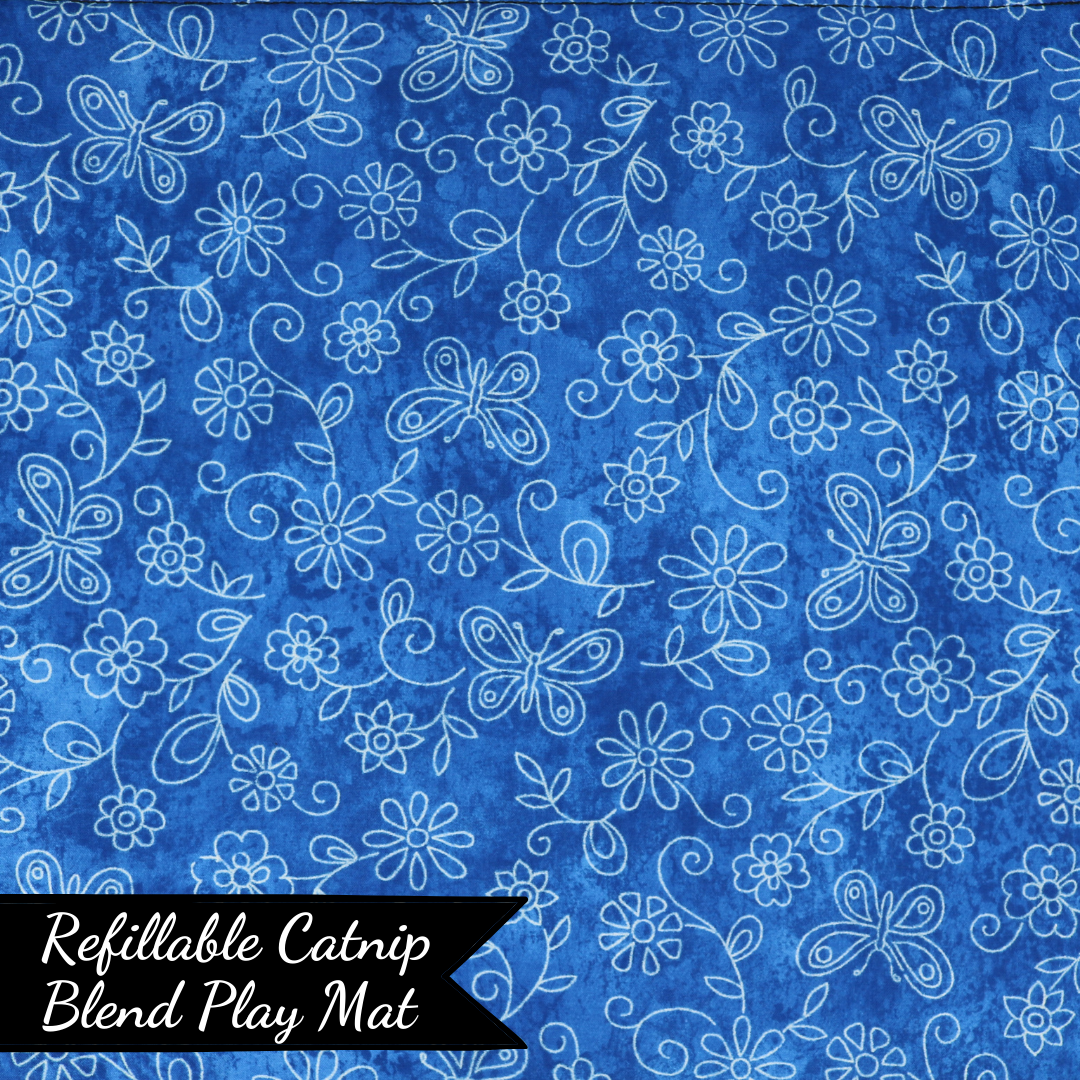 The Luminous Pets Refillable Catnip Mat with Flowers and butterflies on blue | Comes with to refillable pouches of catnip and valerian root
