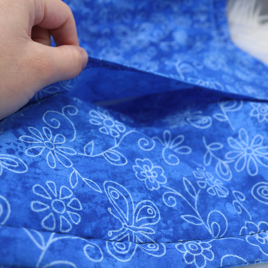 The Luminous Pets Refillable Catnip Mat with Flowers and butterflies on blue | Comes with to refillable pouches of catnip and valerian root
